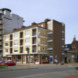 Galerijflat met winkel en wijkpostkantoor - Architectenbureau D. Broos